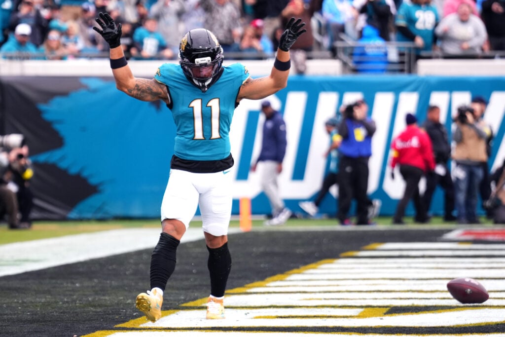 Parker Washington #11 of the Jacksonville Jaguars celebrates after catching a pass for a touchdown against the Tennessee Titans