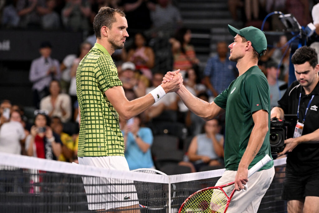 Daniil Medvedev shakes hands with Kamil Majchrzak at the Brisbane International.