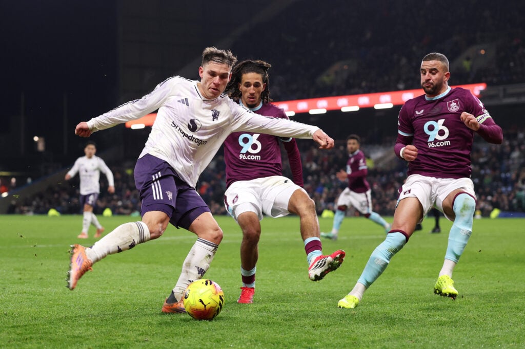 Manuel Ugarte of Manchester United is challenged by Hannibal Mejbri and Kyle Walker of Burnley during the Premier League match between Burnley and Manchester United at Turf Moor on January 07, 2026.