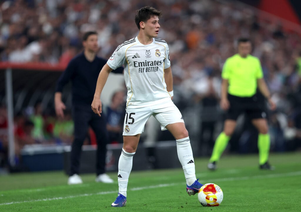 Arda Guler of Real Madrid controls the ball during the Spanish Super Cup Semi-Final match between Real Madrid and Atletico Madrid at King Abdullah Sports City Hall Stadium.