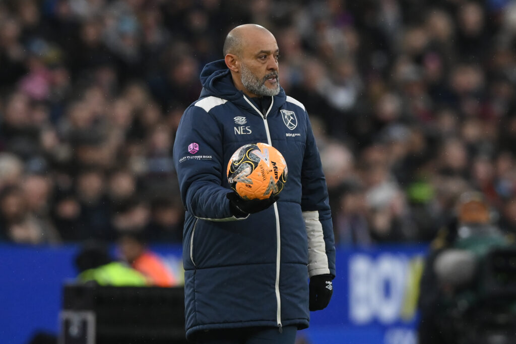Nuno Espirito Santo, manager of West Ham United, holds the match ball in one hand during the Emirates FA Cup Third Round match between West Ham United and Queens Park Rangers