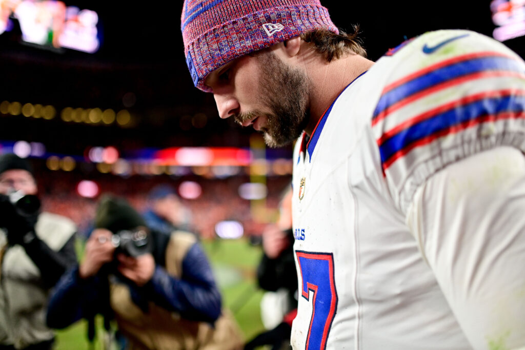 Buffalo Bills quarterback Josh Allen (17) hangs his head as he walks off the field after an overtime loss to the Denver Broncos in the AFC Divisional Round.