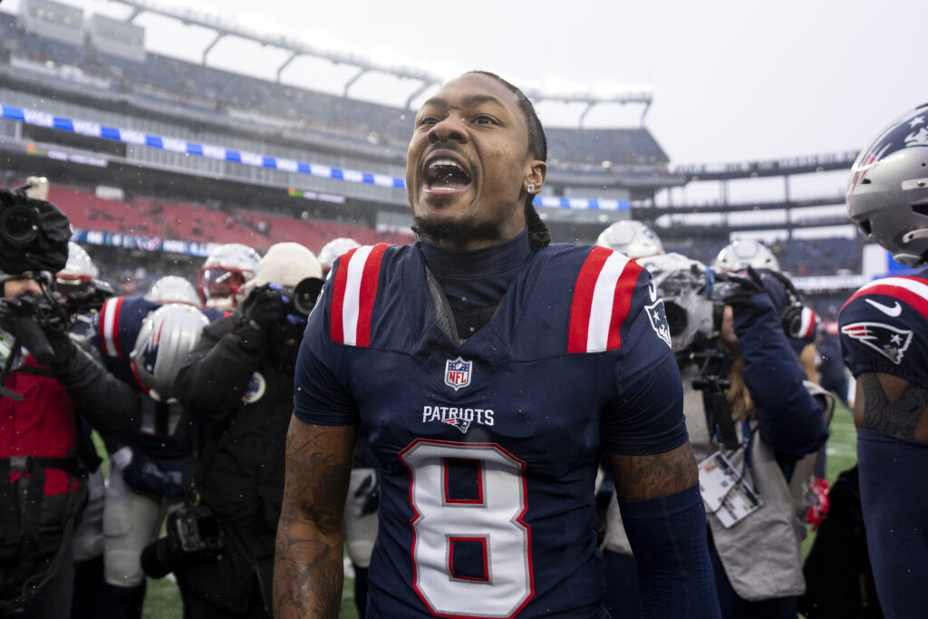 Stefon Diggs #8 of the New England Patriots reacts as he leads a huddle prior to an NFC Divisional Playoff game against the Houston Texans