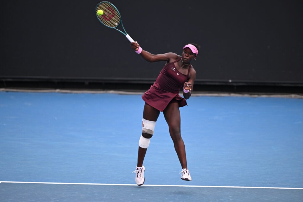 Victoria Mboko hits a shot at the Australian Open.