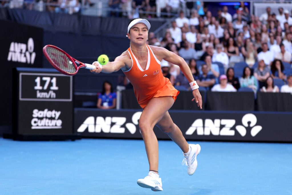 USA's Iva Jovic hits a return to Italy's Jasmine Paolini during their women's singles match on day six of the Australian Open tennis tournament in Melbourne on January 23, 2026.
