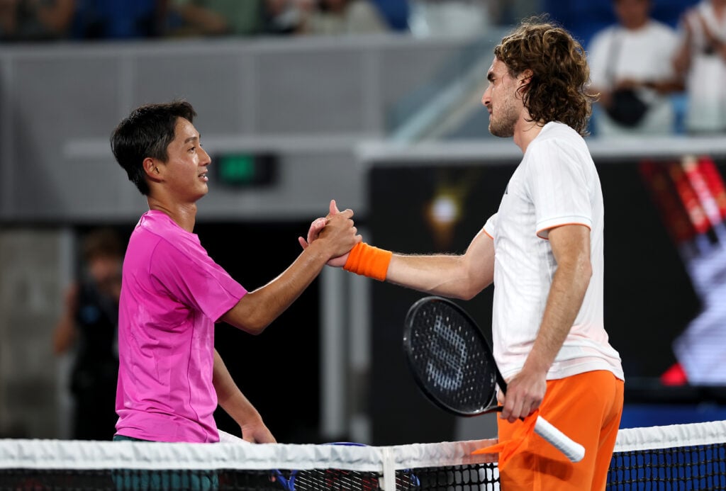 Stefanos Tsitsipas and Shintaro Mochizuki shake hands after their match at the 2026 Australian Open