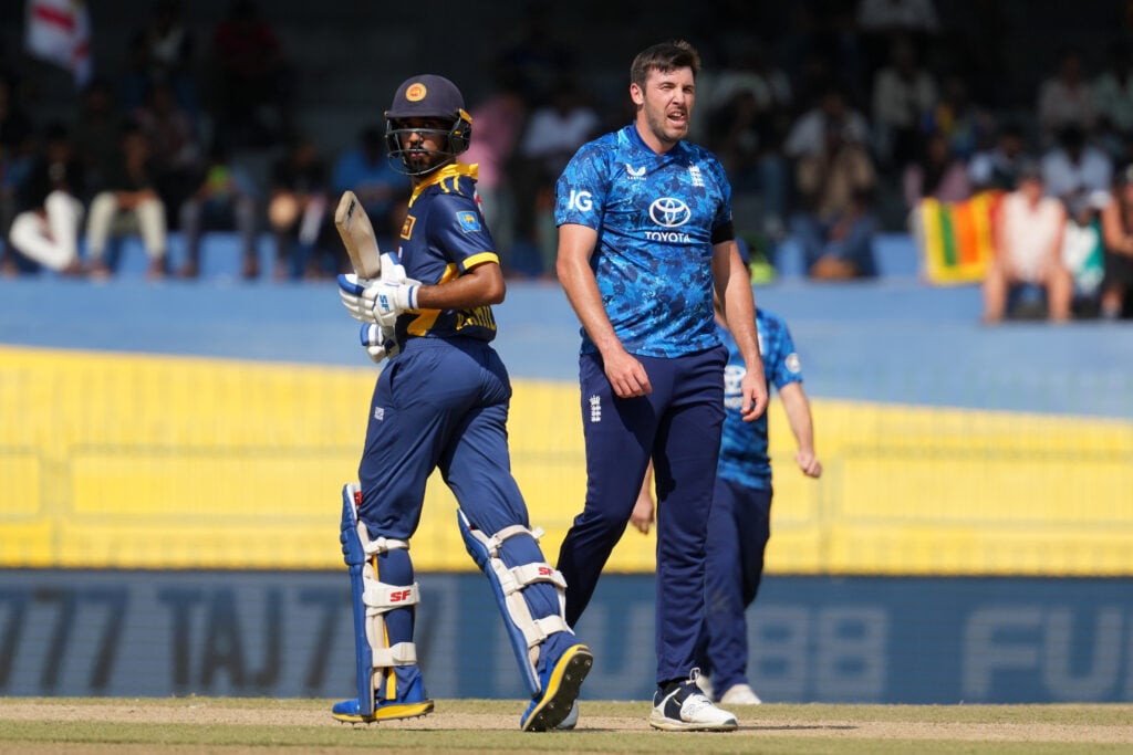Jamie Overton (R) of England watches while Kamil Mishara (L) of Sri Lanka takes a single during the 1st One Day International match between Sri Lanka and England at R. Premadasa Stadium