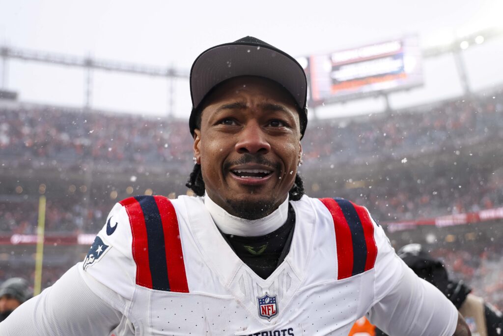 Stefon Diggs #8 of the New England Patriots celebrates after the AFC Championship NFL football game against the Denver Broncos at Empower Field At Mile High.