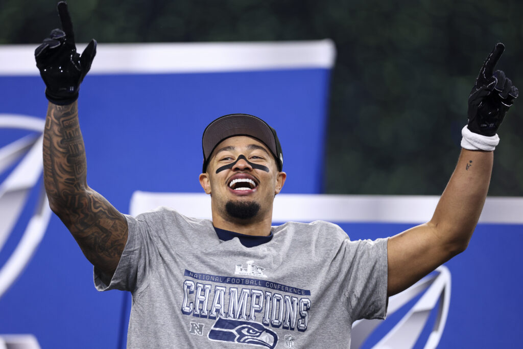 Jaxon Smith-Njigba #11 of the Seattle Seahawks celebrates on stage after the NFC Championship NFL football game.