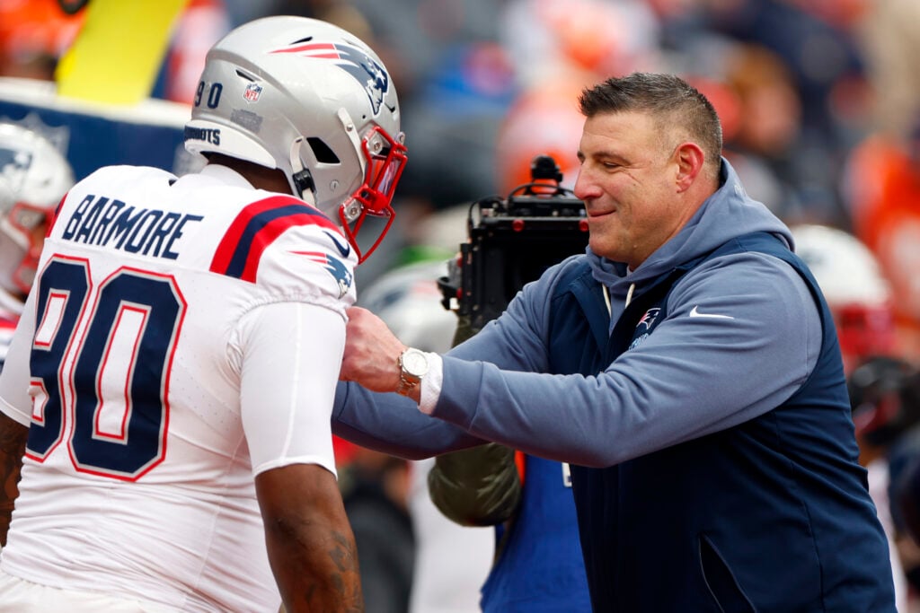 New England Patriots head coach Mike Vrabel jokes with defensive tackle Christian Barmore before the game. The New England Patriots played the Denver Broncos in the AFC Championship Game at Empower Field at Mile High on January 25, 2026.