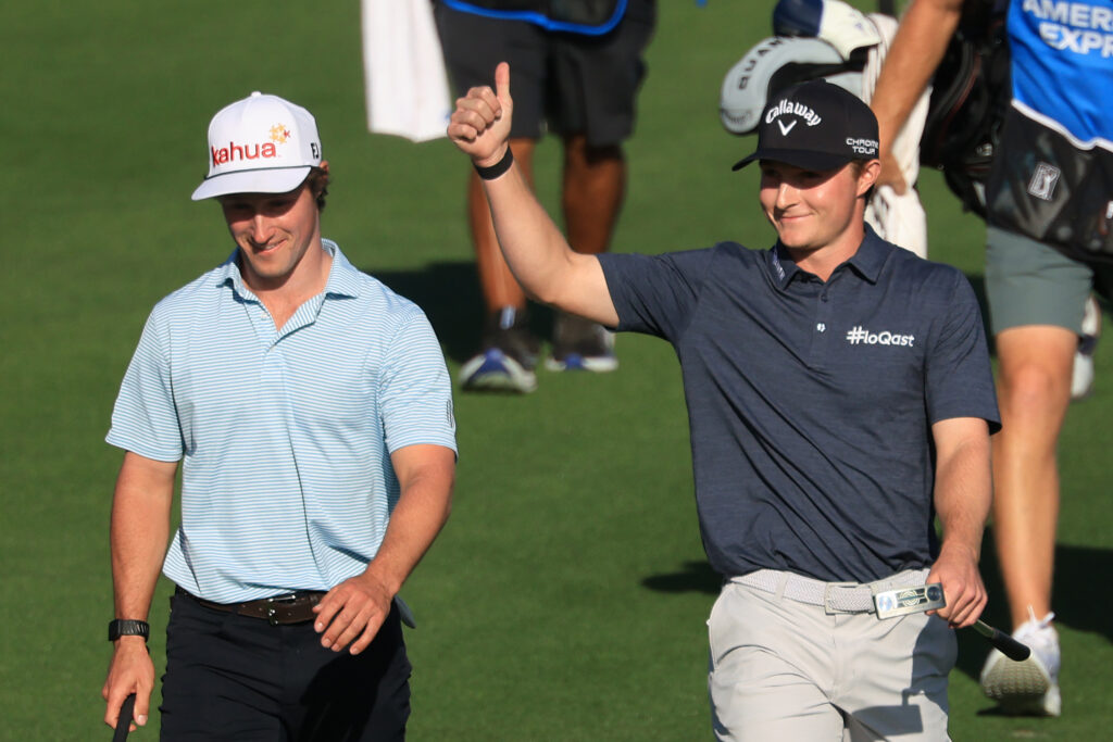 Blades Brown of the United States reacts as he walks up to the ninth green with David Ford of the United States during the second round of The American Express