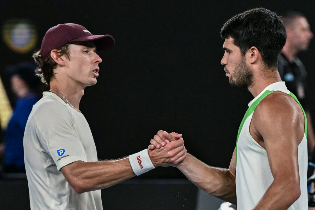 Alex de Minaur shakes hands with Carlos Alcaraz after losing in the quarterfinals of the 2026 Australian Open.