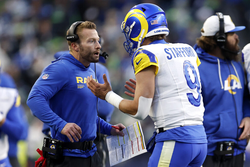 Head coach Sean McVay talks with Matthew Stafford #9 of the Los Angeles Rams during the second quarter against the Seattle Seahawks in the NFC Championship game at Lumen Field.