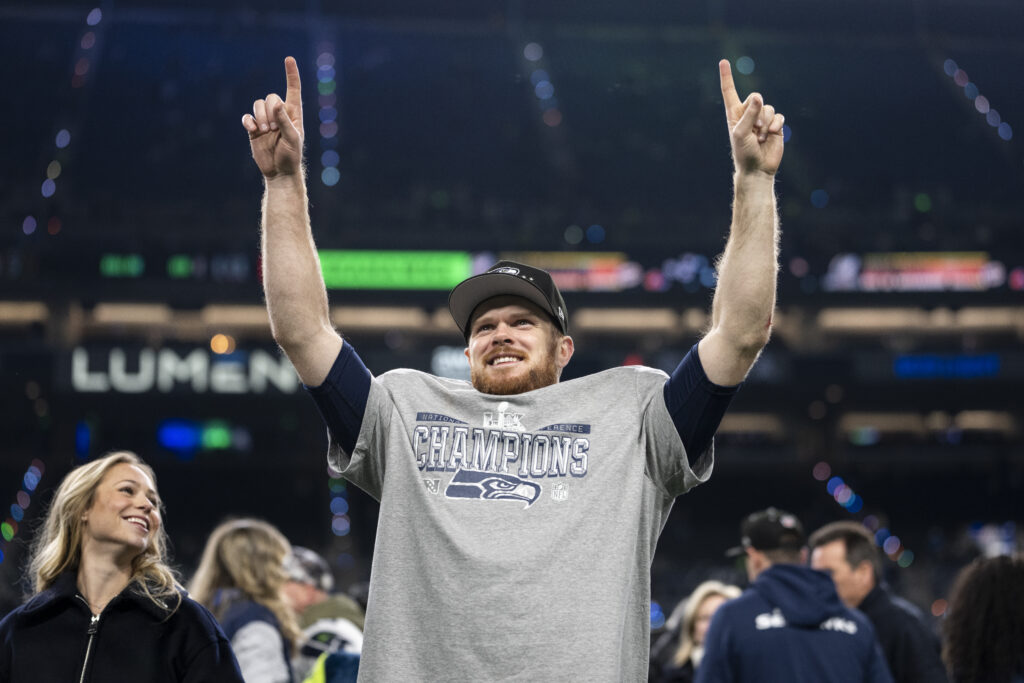 Sam Darnold #14 of the Seattle Seahawks celebrates after defeating the Los Angeles Rams in the NFC Championship game.