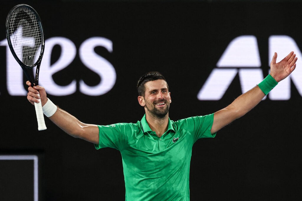 Serbia's Novak Djokovic celebrates victory over Italy's Jannik Sinner after their men's singles semi-final match on day thirteen of the Australian Open tennis tournament in Melbourne.