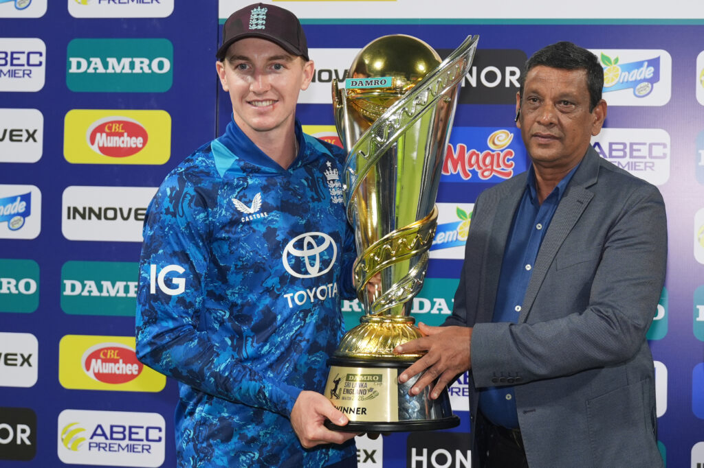 Harry Brook (L) captain of England receives the winning trophy after the 3rd One Day International match between Sri Lanka and England.