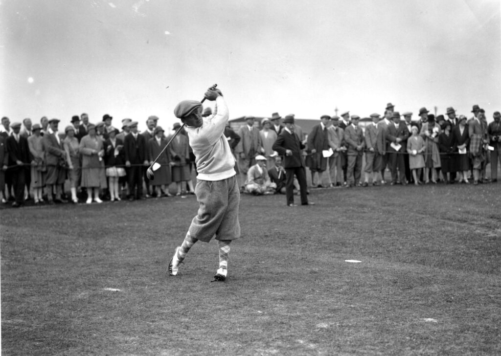 American champion golfer Bobby Jones (1902 - 1971) driving off at St Andrews where he won the British Open Golf Championship.