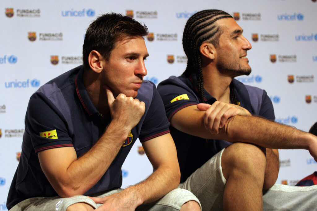 FC Barcelona forward Lionel Messi and his teammate goalkeeper Jose Manuel Pinto share a light moment with Thai children with intellectual disabilities during a UNICEF organized event held to share soccer skills with young disabled children in Bangkok.