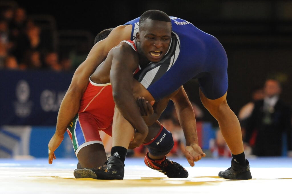 Bokang Masunyane of South Africa (red) against Amit Amit Kumar of India (blue) in the mens 57kg Freestyle wrestling during day 6 of the 20th Commonwealth Games at the Scottish Exhibition Conference Centre.