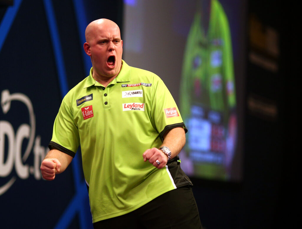 Michael van Gerwen of Holland celebrates winning his third round match against Terry Jenkins of England during the William Hill PDC World Darts Championships on Day Nine at Alexandra Palace on December 29, 2014 in London, England.