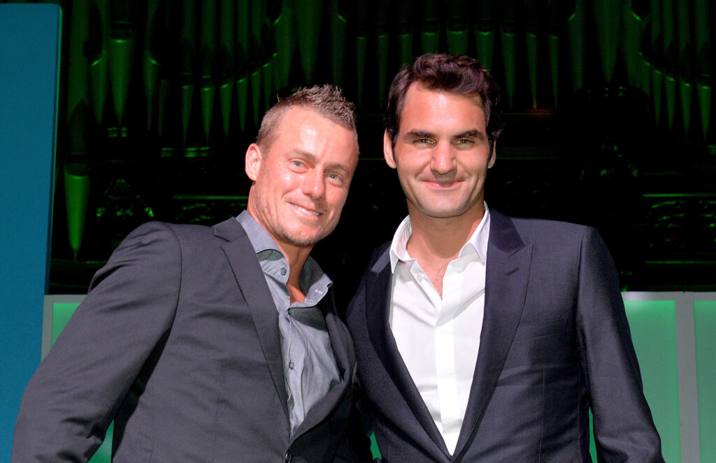 Roger Federer and Lleyton Hewitt pose for a photo after speaking at the A Summer Night with the Stars of International Tennis at the Brisbane Town Hall on January 4, 2015 in Brisbane, Australia.