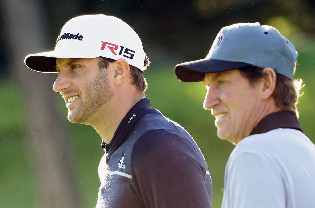 Dustin Johnson (L) waits alongside hockey legend Wayne Gretzky during the first round of the AT&T Pebble Beach National Pro-Am a