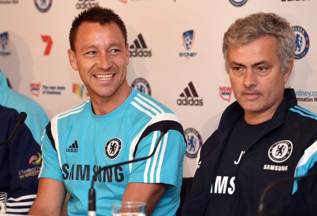 Chelsea football captain John Terry (L) smiles during a press conference with coach José Mourinho.