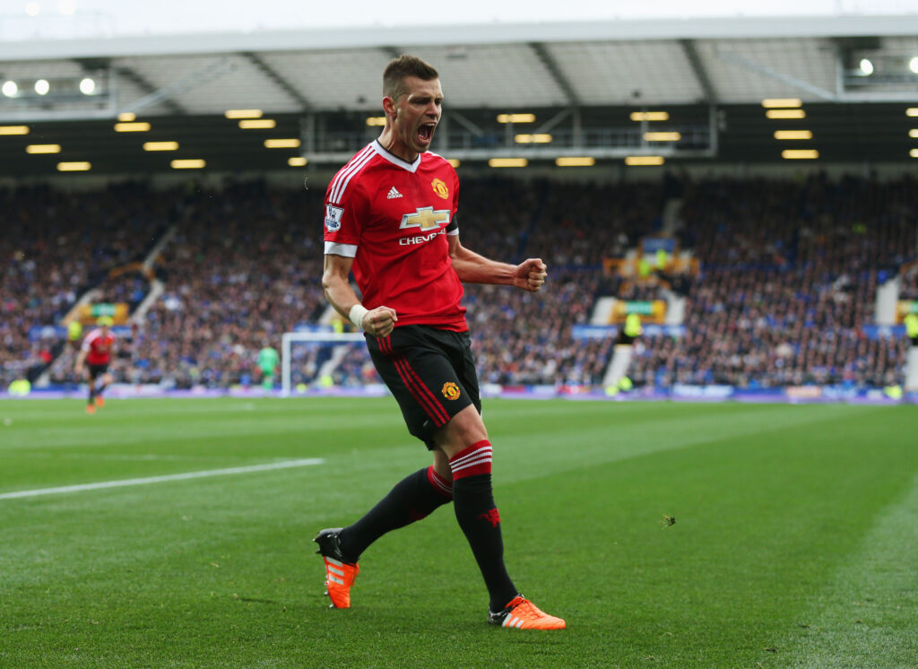 Morgan Schneiderlin of Manchester United celebrates scoring his team's first goal during the Barclays Premier League match between Everton and Manchester United at Goodison Park.