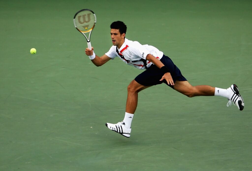 Novak Djokovic of Serbia returns a shot against Roger Federer of Switzerland during the Men's Singles Final on day fourteen of the 2007 U.S. Open in Arthur Ashe Stadium at the Billie Jean King National Tennis Center on September 9, 2007 in the Flushing neighborhood of the Queens borough of New York City.
