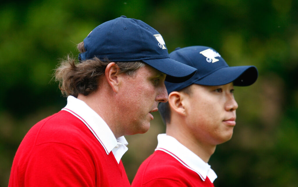 Phil Mickelson and Anthony Kim of the USA Team walk down the first fairway during the Day One Foursome Matches of The Presidents Cup at Harding Park Golf Course on October 8, 2009.