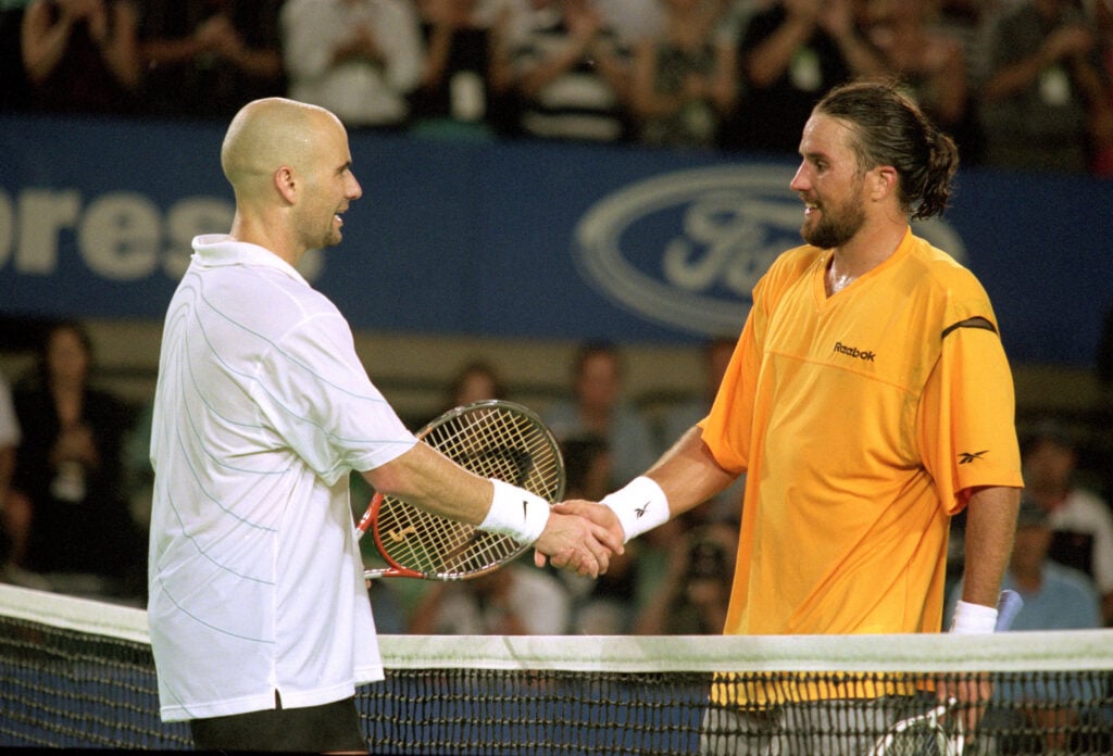 Andre Agassi and Pat Rafter shake hands after their match at the 2001 Australian Open
