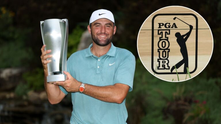 Scottie Scheffler of the United States poses with the tournament trophy after his winning round on the 18th green after the final round of the BMW ...
