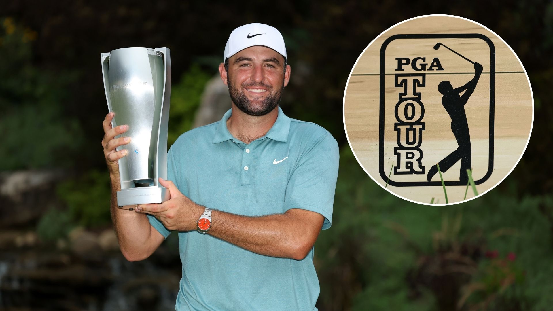 Scottie Scheffler of the United States poses with the tournament trophy after his winning round on the 18th green after the final round of the BMW ...