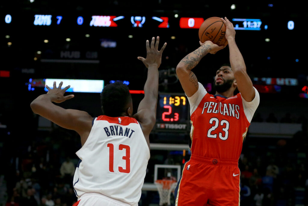 Anthony Davis #23 of the New Orleans Pelicans is defended by Thomas Bryant #13 of the Washington Wizards during a game at the Smoothie King Center on November 28, 2018 in New Orleans, Louisiana.