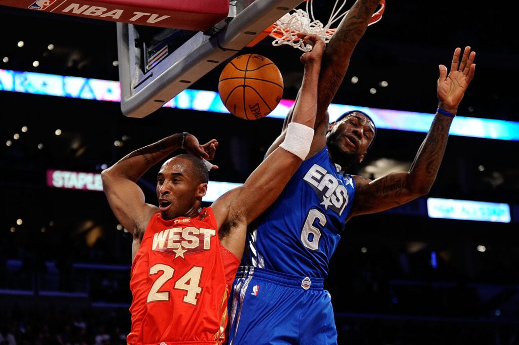 Kobe Bryant #24 of the Los Angeles Lakers and the Western Conference dunks in front of LeBron James #6 of the Miami Heat and the Eastern Conference in the second half of the 2011 NBA All-Star Game at Staples Center on February 20, 2011 in Los Angeles, California.