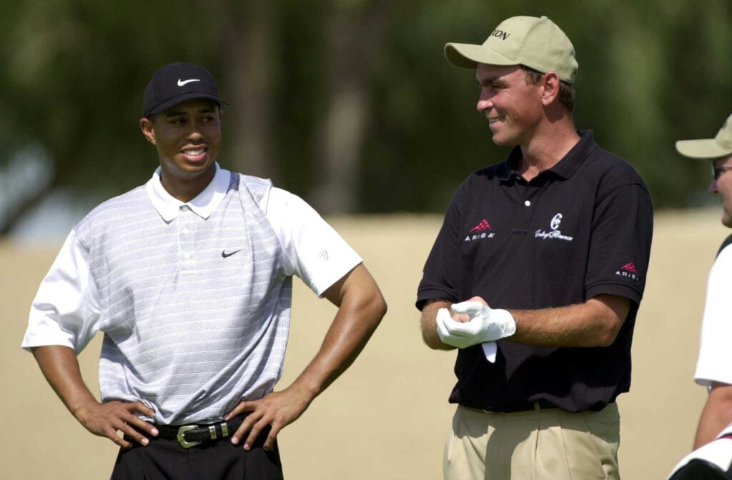 Tiger Woods of the United States and Thomas Bjorn of Denmark on the 13th hole during round on day one of the Dubai Desert Classic in Dubai