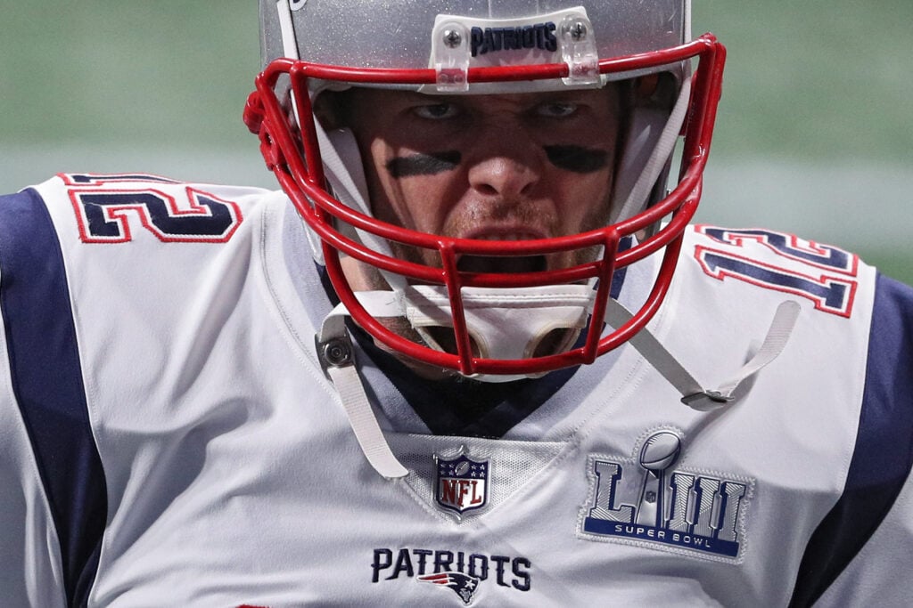 Tom Brady #12 of the New England Patriots warms up prior to Super Bowl LIII against the Los Angeles Rams at Mercedes-Benz Stadium on February 03, 2019 in Atlanta, Georgia.