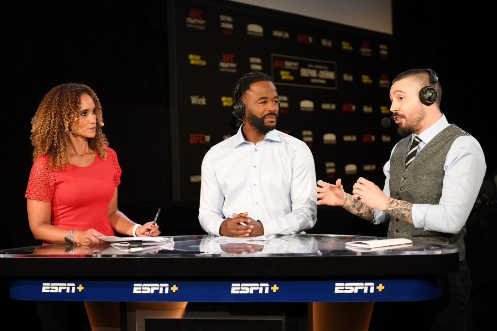 Dan Hardy, Rashad Evans, and Karyn Bryant interact during the UFC Fight Night weigh-in broadcast at Yubileyny Sports Palace.