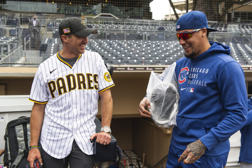 Saints quarterback Drew Brees meets with Javier Baez #9 of the Chicago Cubs before facing the San Diego Padres at Petco Park on June 7, 2021 in San Diego, California.