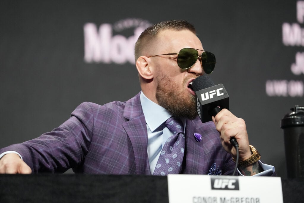 Dana White introduces Dustin Poirier and Conor McGregor to the press and the public for the first time back with fans in attendance at the UFC 264.
