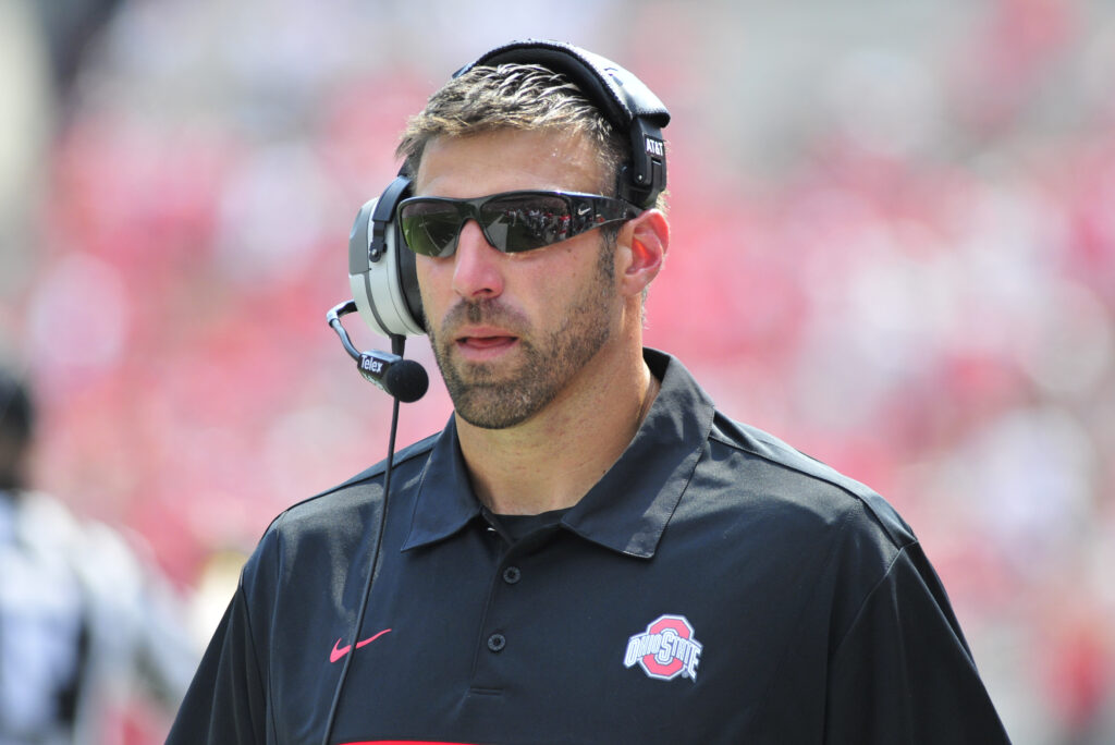 Linebackers coach Mike Vrabel of the Ohio State University walks the sideline during a game with the Akron Zips at Ohio Stadium.