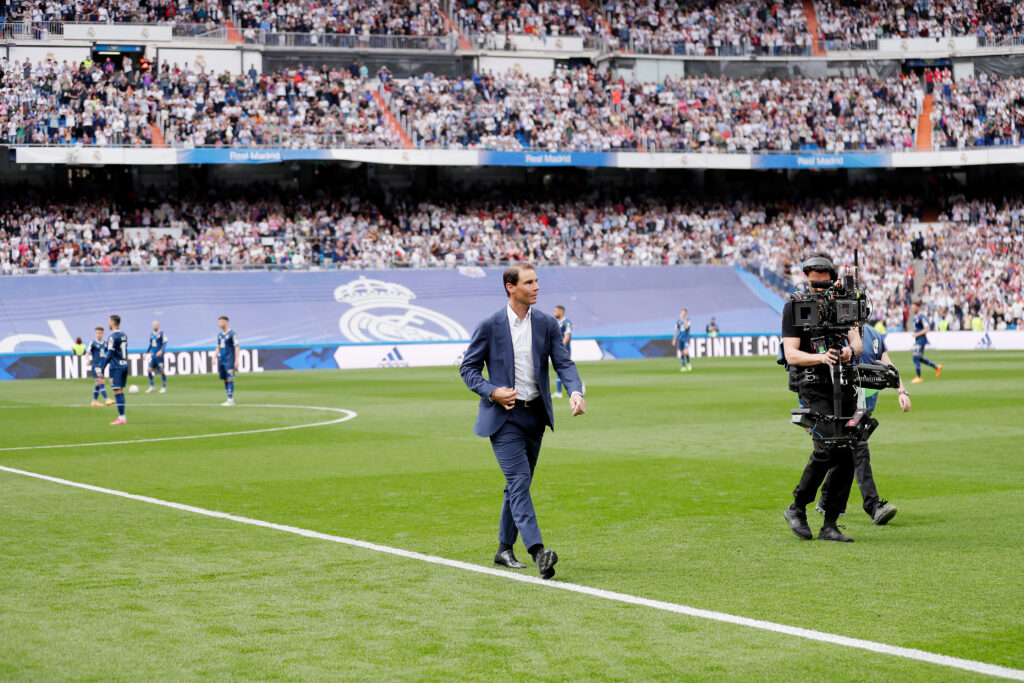 Rafael Nadal walks into the pitch at a Real Madrid game