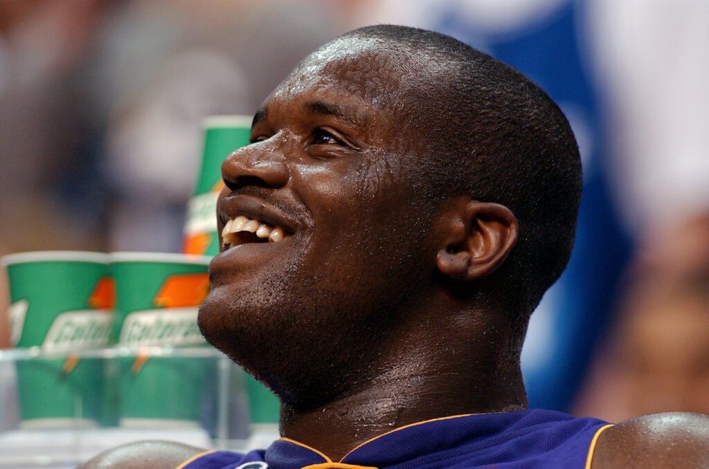 Shaquille O'Neal #34 of the Los Angeles Lakers watches the game against the Washington Wizards on April 2, 2002 at the MCI Center.