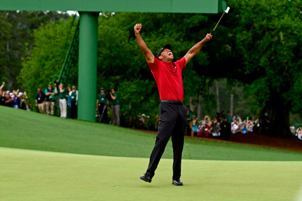 Masters champion Tiger Woods celebrates after making his putt on hole No. 18 to win the Masters in 2019