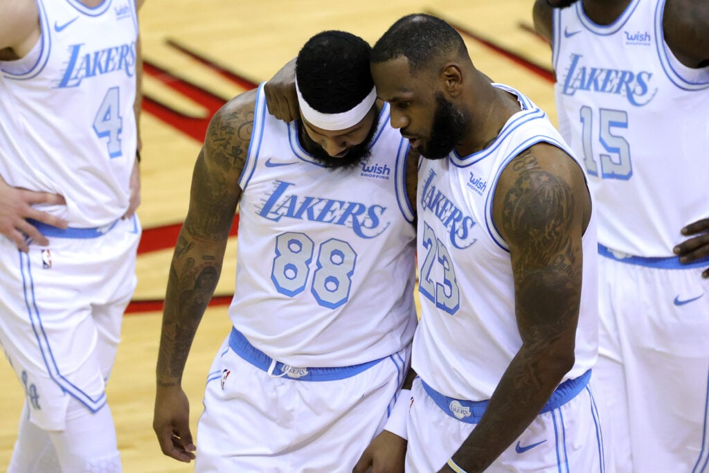 LeBron James #23 of the Los Angeles Lakers consoles Markieff Morris #88 during the first quarter of a game against the Houston Rockets at Toyota Center.