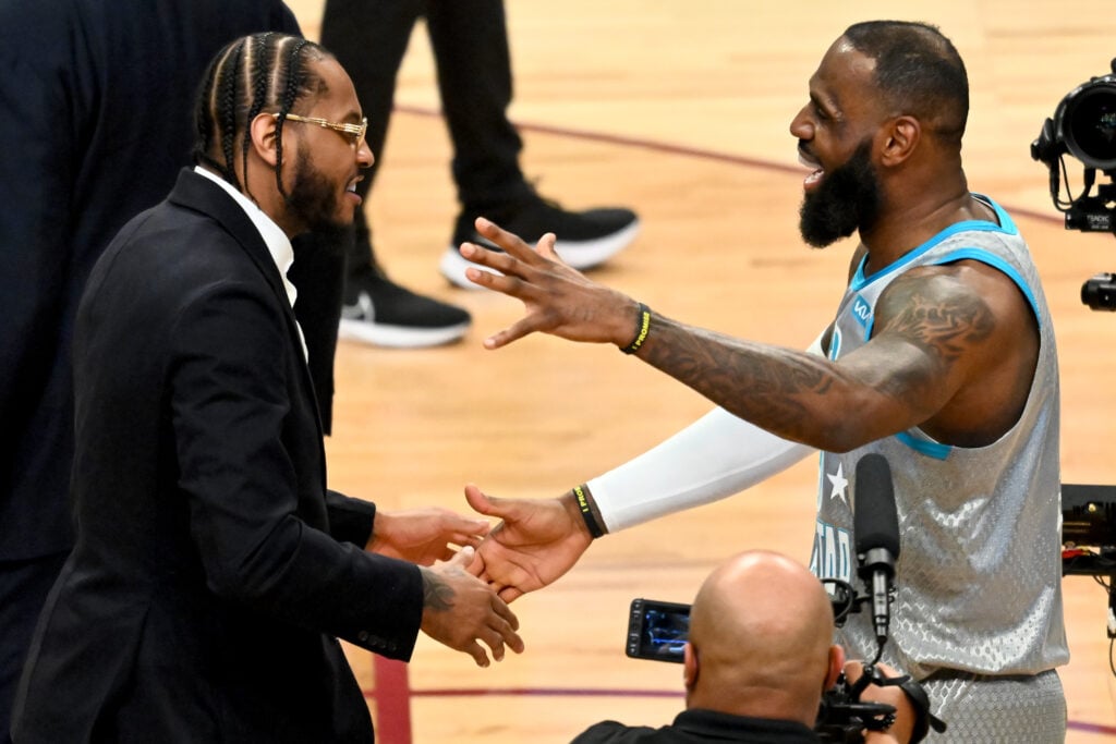 Carmelo Anthony #7 of the Los Angeles Lakers and LeBron James #6 of Team LeBron embrace after the 2022 NBA All-Star Game at Rocket Mortgage Fieldhouse on February 20, 2022 in Cleveland, Ohio.