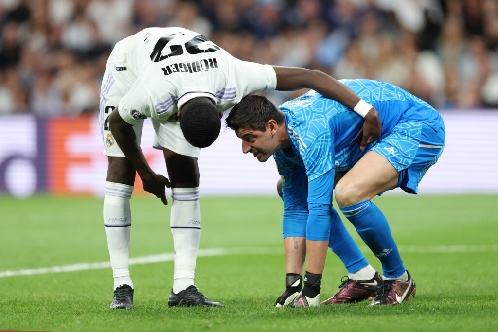 Antonio Ruediger reacts with Thibaut Courtois of Real Madrid during the UEFA Champions League semi-final first leg match between Real Madrid and Manchester City FC at Estadio Santiago Bernabeu on May 09, 2023 in Madrid, Spain.
