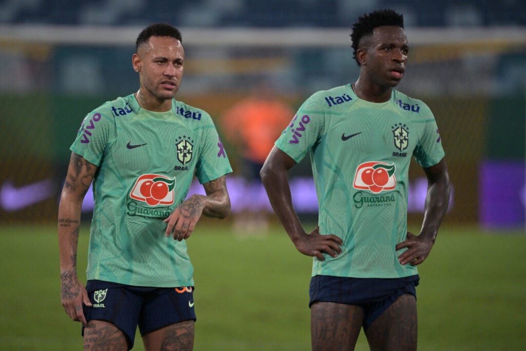 Brazil's forwards Neymar (L) and Vinicius Jr take part in a training session at the Arena Pantanal stadium in Cuiaba, Brazil, on October 10, 2023, ahead of FIFA World Cup 2026 qualifier football matches against Venezuela and Uruguay.