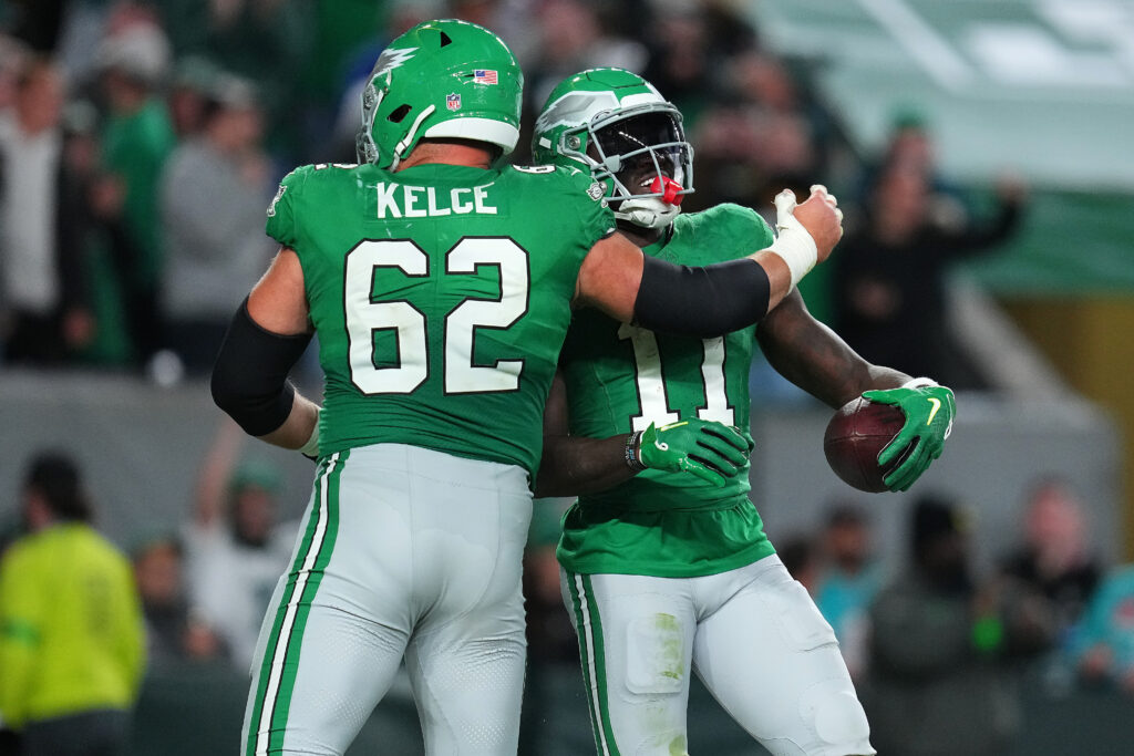 A.J. Brown #11 is congratulated by Jason Kelce #62 of the Philadelphia Eagles after scoring a touchdown during the second half of a game against the Miami Dolphins at Lincoln Financial Field on October 22, 2023 in Philadelphia, Pennsylvania