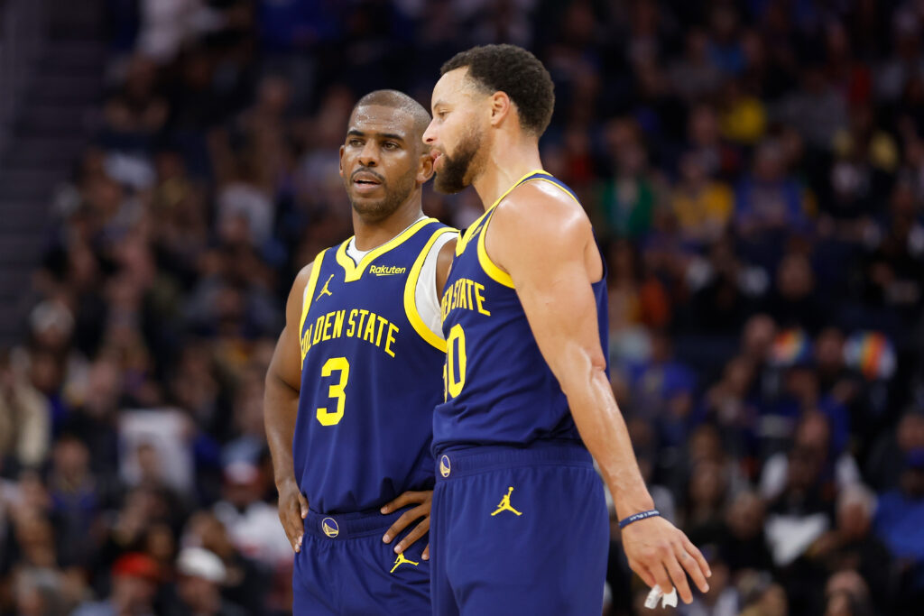 Chris Paul #3 talks to Stephen Curry #30 of the Golden State Warriors during the game S at Chase Center.